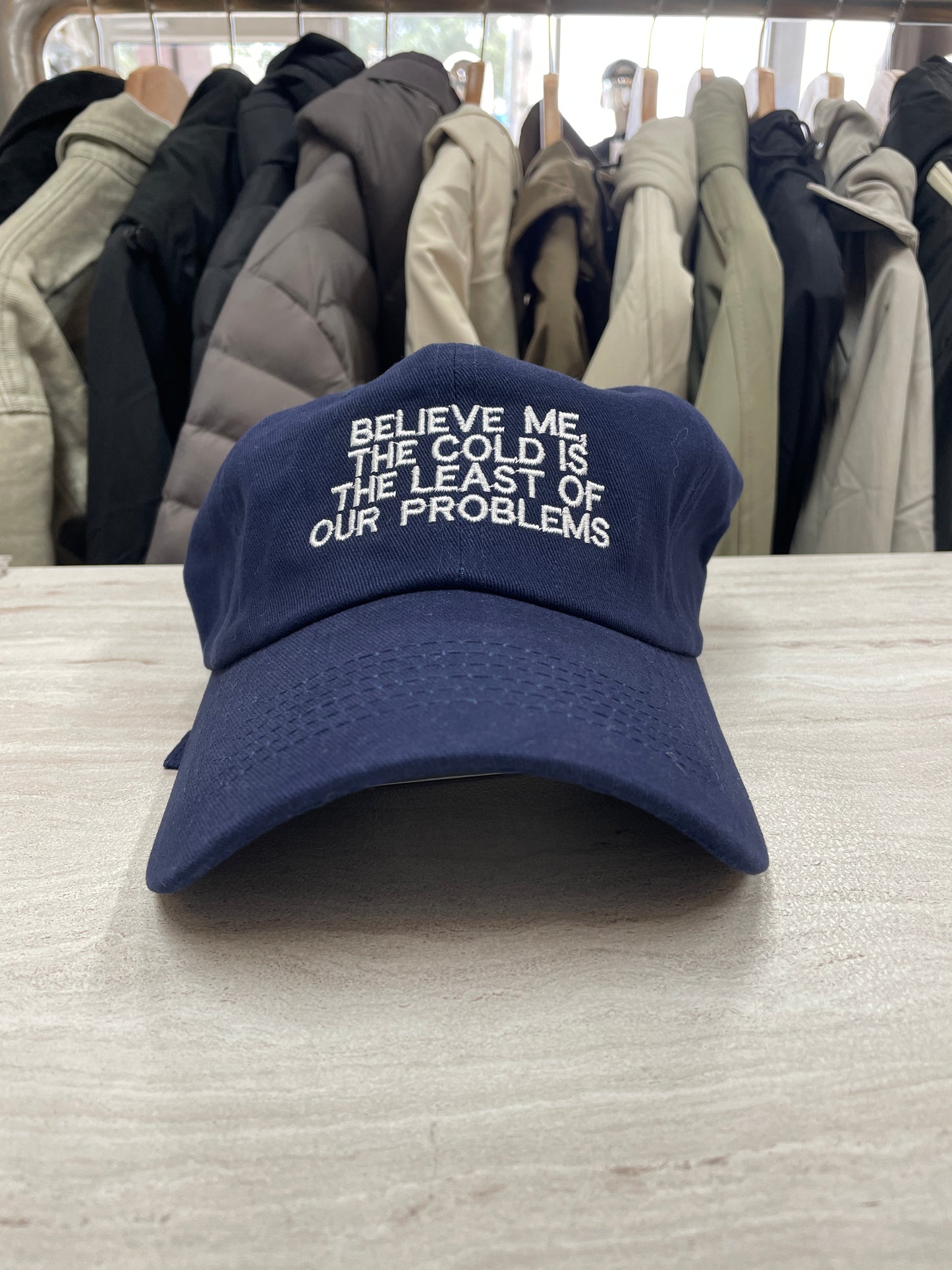 GORRA “BELIEVE ME THE COLD IS THE LEAST OF OUR PROBLEMS”